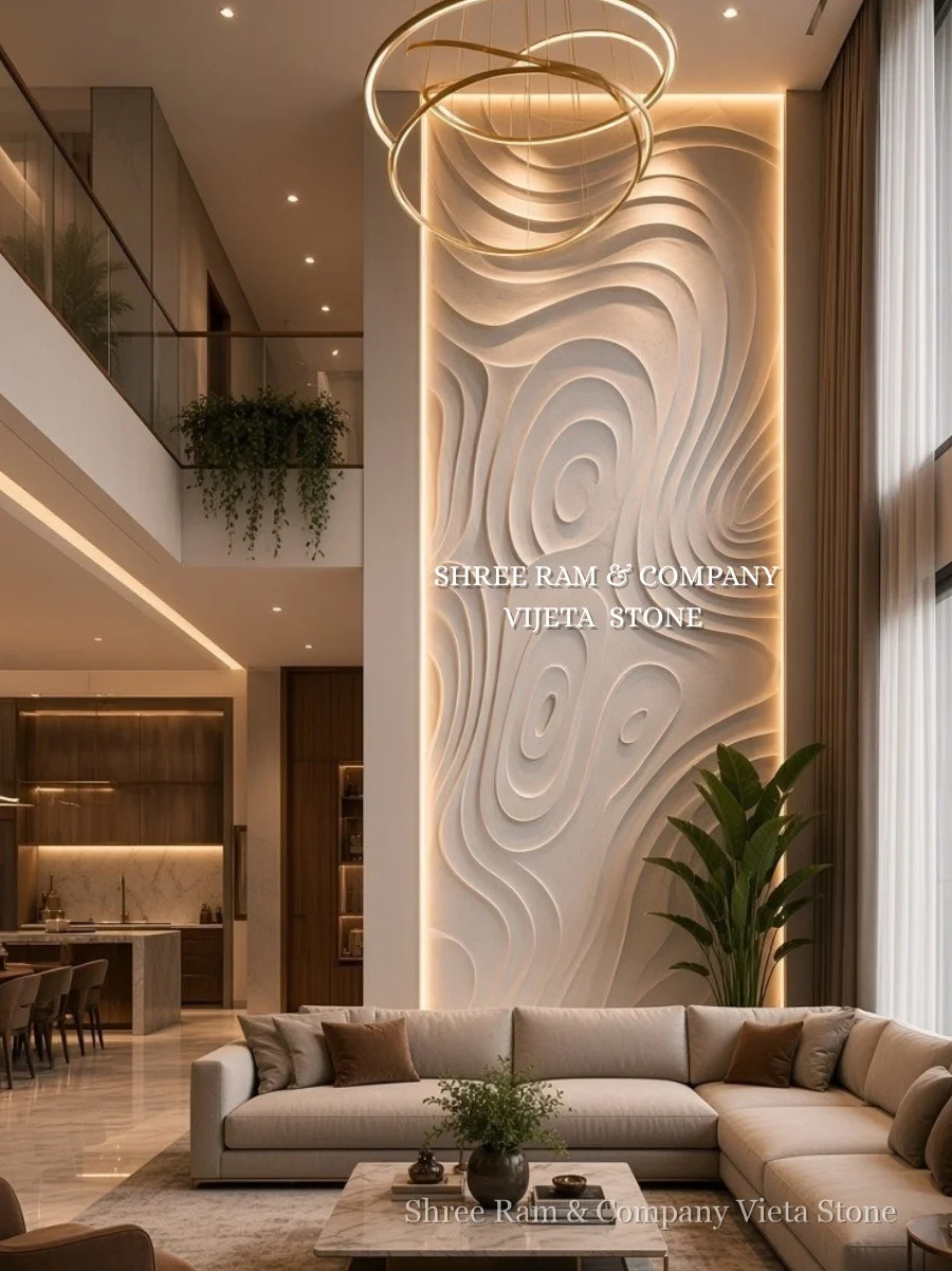 Contemporary organic contour wave hand-carved stone wall panel with warm ambient backlighting in luxury double-height villa living room - Shree Ram and Company Vijeta Stone